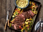 grilled southwestern steak and colorful vegetables friends entertaining